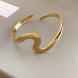 Elegant Open Bracelet with Wavy Gold Pattern