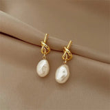 Earrings with Baroque Pearls in Gold