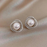 Shimmering Spiral Earrings with Elegant Pearls