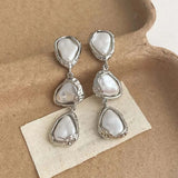 Silhouette Triangular Earrings with Daisies