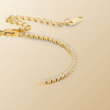 Cordelia Gold Tennis Bracelet on champagne lunar background