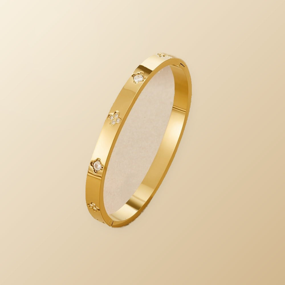 Gold Clover Bangle on champagne lunar background