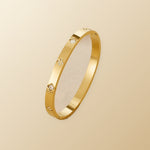 Gold Clover Bangle on champagne lunar background