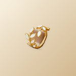 Gold Leaf Ring on champagne lunar background