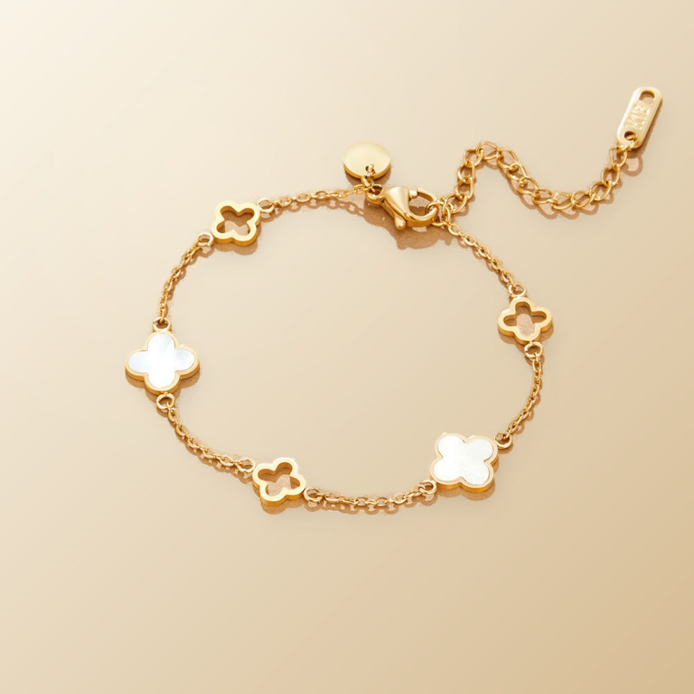 Lucia Clover Bracelet on champagne lunar background